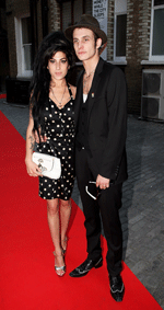 winehouse%26hubby photo winehouse%26hubby Festivals round up: T In The Park, Roskilde, Oxegen further spirits undampened, exhausted Winehouse visits pub shocker